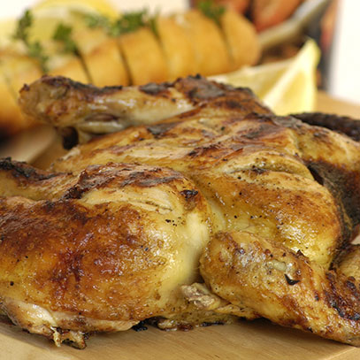 Butterfly Lemon Chicken with Bacon over the coals