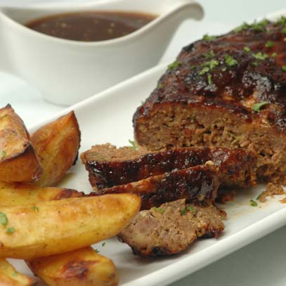 Glazed Meatloaf with Cheese, Baked Potatoes and Onions