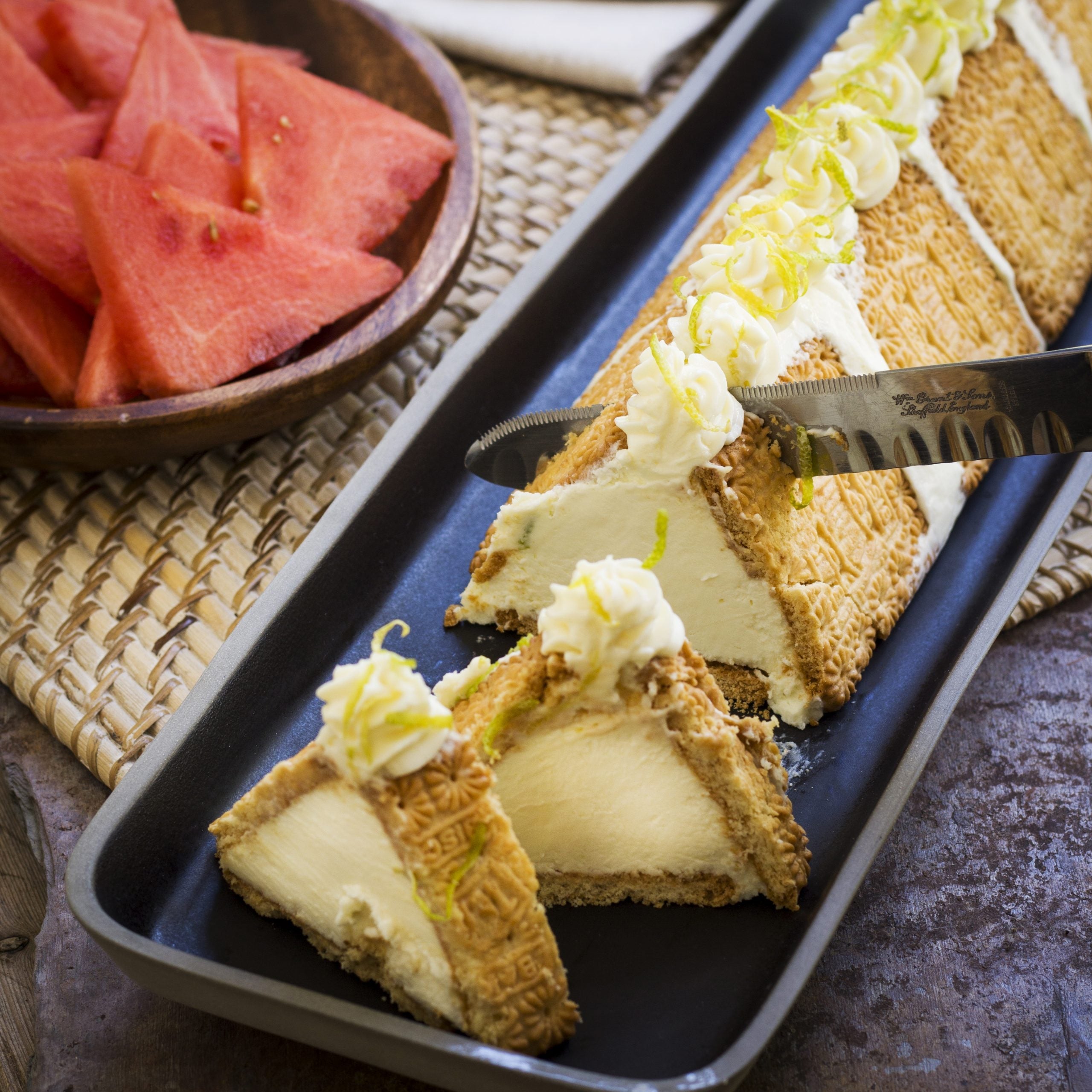 Triangular Lemon Cheesecake Served with Fresh Watermelon