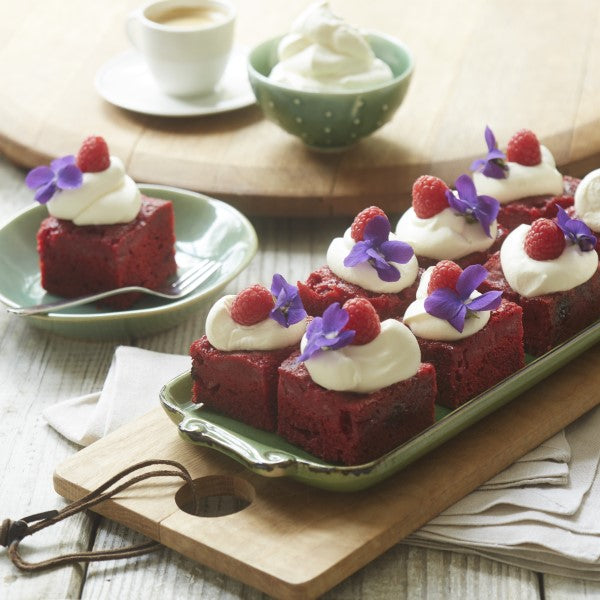 Red Velvet Squares with Whipped Cream and Raspberries